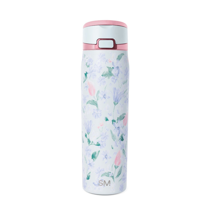 White insulated water bottle with pink rim and lid featuring watercolor lavender, blue, and pink flowers with green and teal leaves. Simple Modern SM logo on lower front. Push-button lid with burgundy clasp.